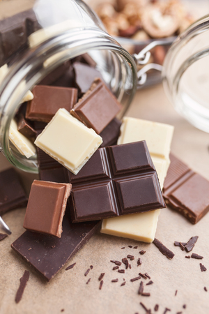 Variety of delicious chocolate bars in a jarの写真素材