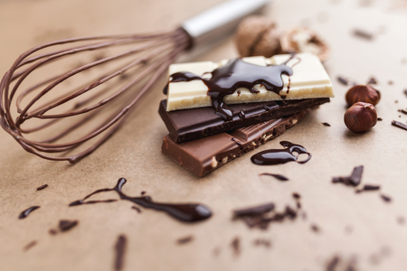 Variety of delicious chocolate bars with melted chocolateの写真素材