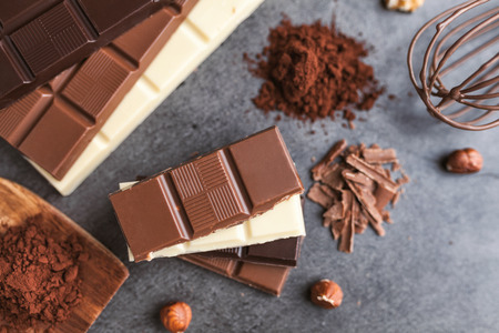 Delicious and sweet variety of chocole on rustic backgroundの写真素材