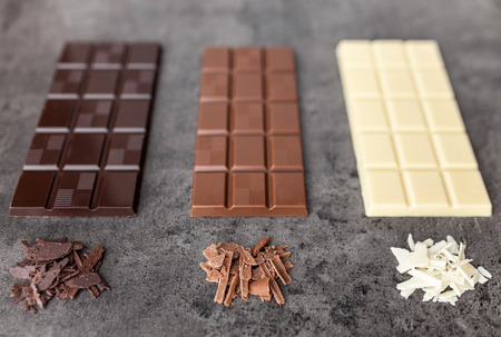 Delicious and sweet variety of chocole on rustic backgroundの写真素材