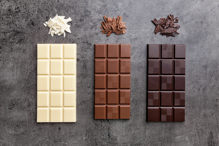Delicious and sweet variety of chocole on rustic backgroundの写真素材