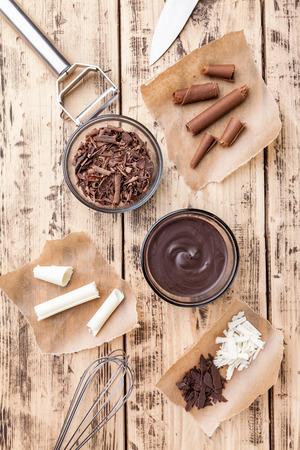 Delicious and sweet chocolate swirls on wooden backgroundの写真素材