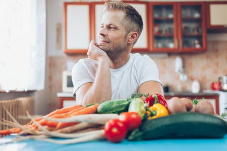 Young man at home on a healthy dietの写真素材
