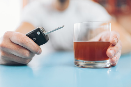 Drunk man at the bar intends to drive back homeの写真素材