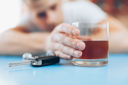 Drunk man at the bar intends to drive back homeの写真素材