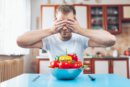 Young man at home on a healthy dietの写真素材