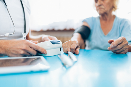 Senior woman during a medical exam with her practitionerの写真素材