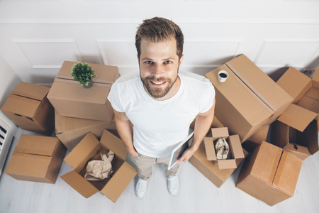 Top view. Man moving into his new homeの写真素材