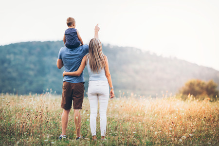 Happy family enjoying time spent together outdoorsの写真素材