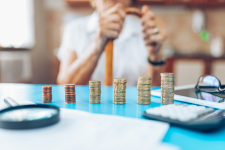 Senior woman at home checking her finances and investmentsの写真素材