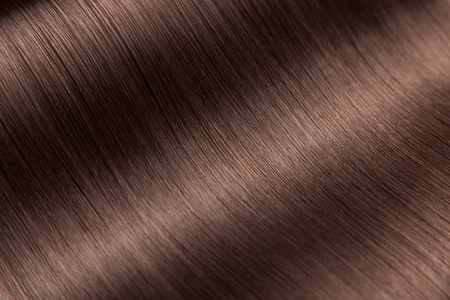 Closeup on luxurious straight glossy brown hairの写真素材
