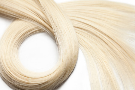 Closeup on luxurious straight glossy blonde hairの写真素材