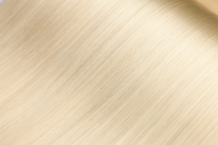 Closeup on luxurious straight glossy blonde hairの写真素材