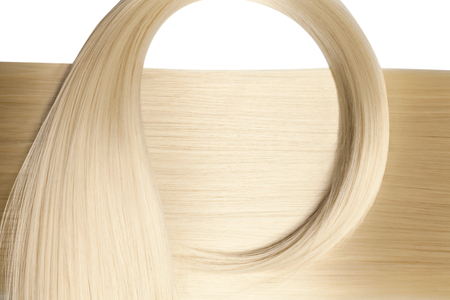 Closeup on luxurious straight glossy blonde hairの写真素材