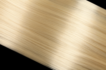 Closeup on luxurious straight glossy blonde hairの写真素材