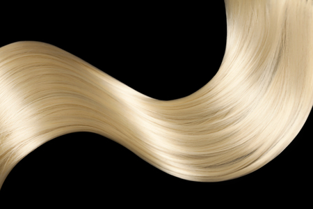 Closeup on luxurious straight glossy blonde hairの写真素材
