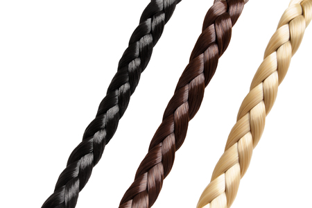 Black brown and blonde plaits on whiteの写真素材