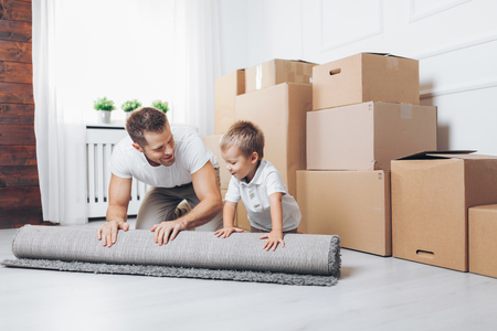 Moving concept, Father and his son moving into their new homeの写真素材