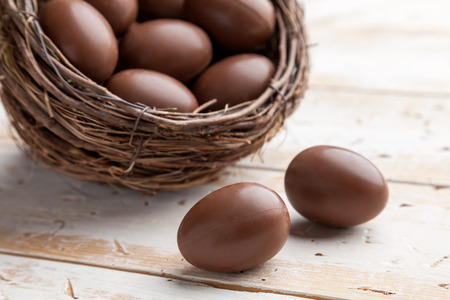 Delicious chocolate Easter holiday egg on rustic backgroundの写真素材