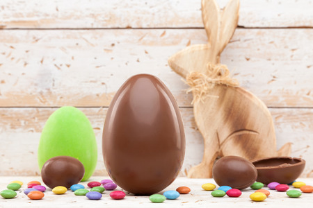 Delicious chocolate Easter holiday egg on rustic backgroundの写真素材