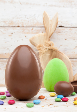 Delicious chocolate Easter holiday egg on rustic backgroundの写真素材