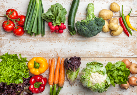 Fresh and healthy organic vegetables on a rustic backgroundの写真素材