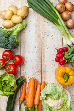 Fresh and healthy organic vegetables on a rustic backgroundの写真素材