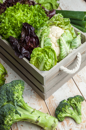 Fresh and healthy organic vegetables on a rustic backgroundの写真素材