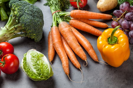 Fresh and healthy organic vegetables on a rustic backgroundの写真素材