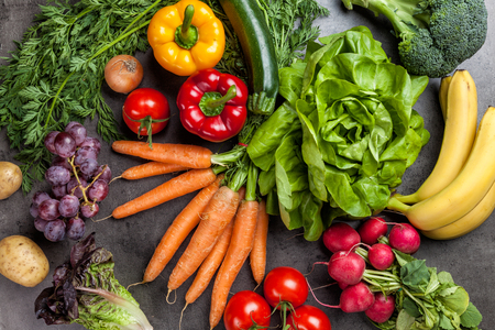 Fresh and healthy organic vegetables on a rustic backgroundの写真素材