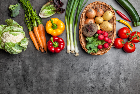 Fresh and healthy organic vegetables on a rustic backgroundの写真素材