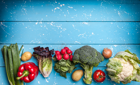 Fresh and healthy organic vegetables on a rustic backgroundの写真素材