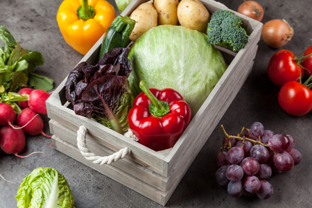 Fresh and healthy organic vegetables on a rustic backgroundの写真素材