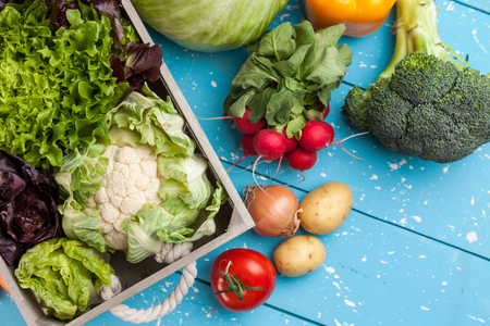 Fresh and healthy organic vegetables on a rustic backgroundの写真素材
