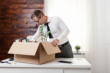 Successful businessman moving into a new officeの写真素材