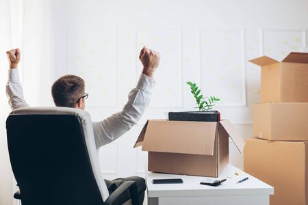 Successful businessman moving into a new officeの写真素材