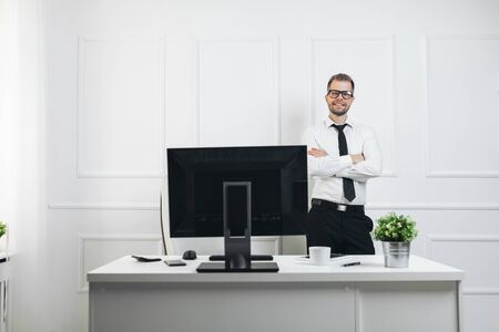Successful handsome businessman working in his officeの写真素材