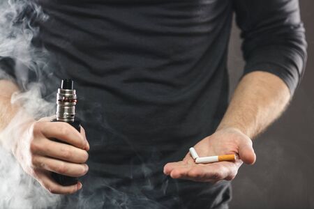 Vaping flavored e-liquid from an electronic cigaretteの写真素材