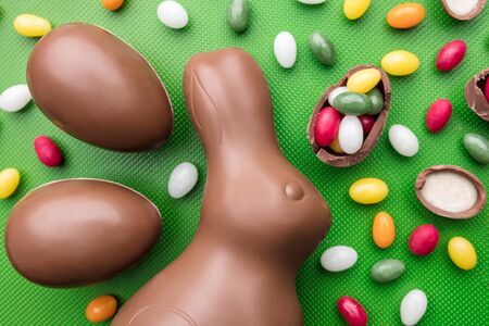 Delicious Easter holiday chocolate bunny, eggs and sweetsの写真素材