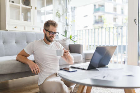 Man working from home during the coronavirus Covid 19 pandemicの写真素材
