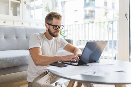 Man working from home during the coronavirus Covid 19 pandemicの写真素材