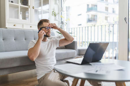 Man working from home during the coronavirus Covid 19 pandemicの写真素材