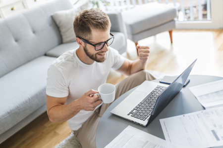 Man working from home during the coronavirus Covid 19 pandemicの写真素材