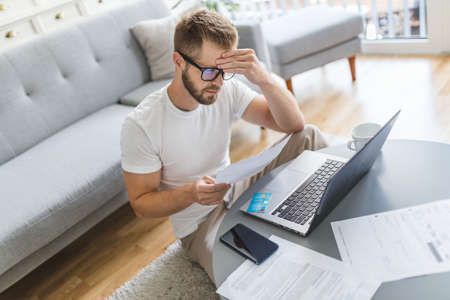 Man working from home during the coronavirus Covid 19 pandemicの写真素材