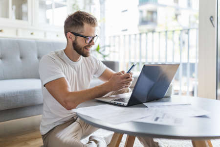 Man working from home during the   pandemicの写真素材