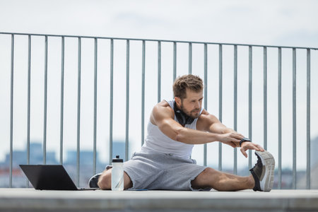 Handsome young man training and working out outdoorsの写真素材