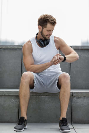 Handsome young man training and working out outdoorsの写真素材