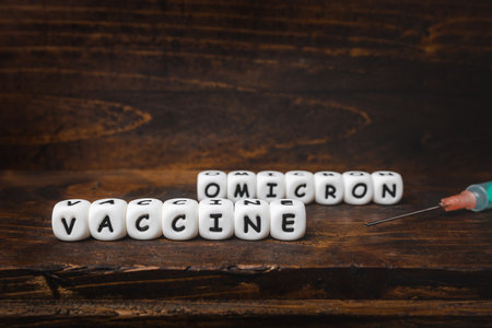 Corona virus Covid-19 vaccine text on wooden backgroundの写真素材