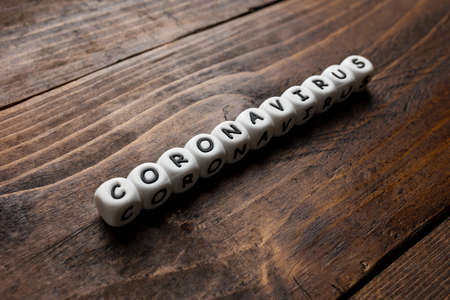 Corona virus Covid-19 vaccine text on wooden backgroundの写真素材