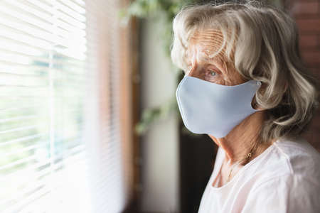 Elderly woman with a face mask during lockdownの写真素材